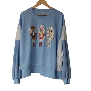 Blue Sweatshirt with Sequin Nutcracker Design